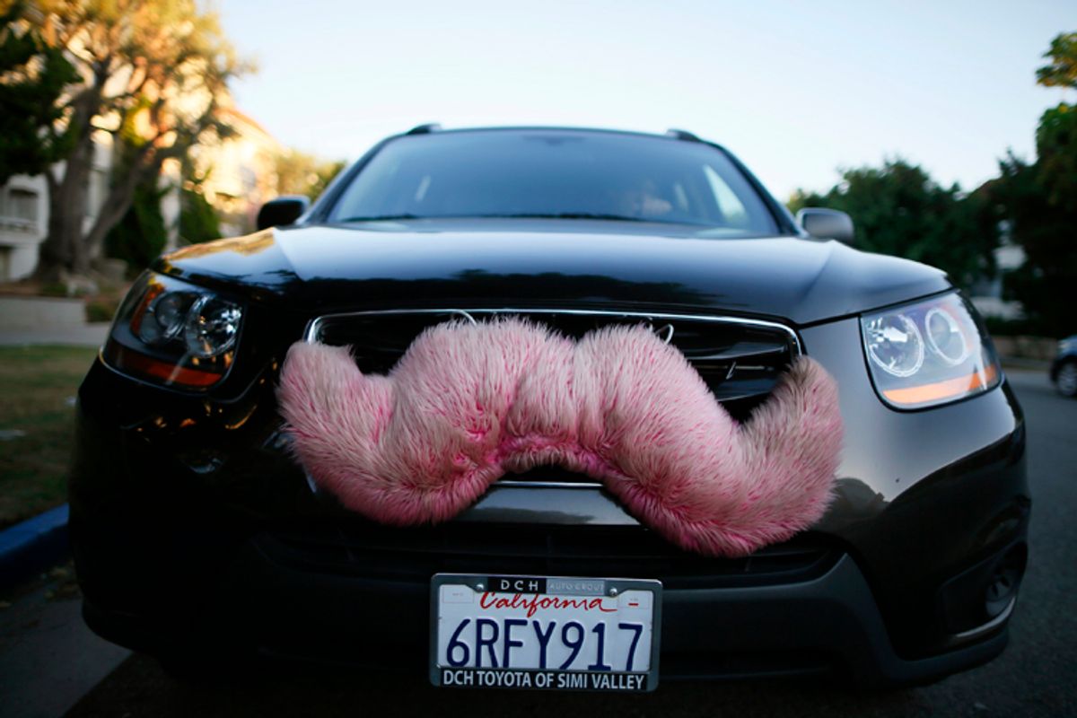 A driver with the ride-sharing service Lyft waits for a customer on a street in Santa Monica, Calif., Oct. 17, 2013.        (Reuters/Lucy Nicholson)