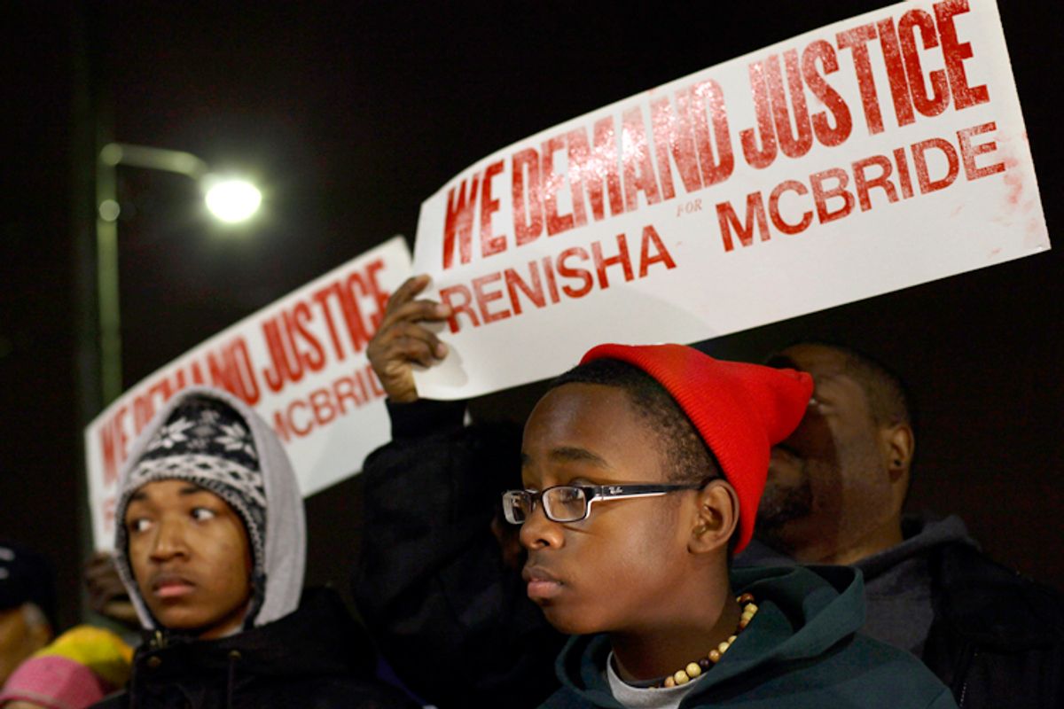 Demonstrators protest the killing of 19-year-old Renisha McBride outside Dearborn Heights Police Station in Dearborn Heights, Michigan November 7, 2013.          (Reuters/Joshua Lott)