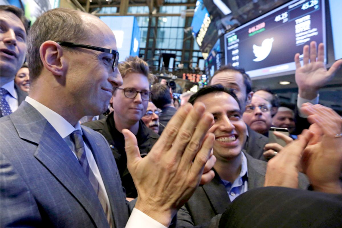Twitter CEO Dick Costolo, left, co-founder Biz Stone, center, and Amir Movafaghi, right, Twitter's Director of Treasury and Strategic Finance, applaud as shares begin trading in their IPO, on the floor of the New York Stock Exchange, Nov. 7, 2013.            (AP/Richard Drew)