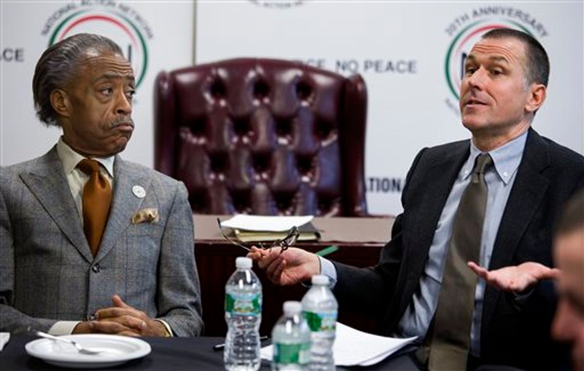 The Rev. Al Sharpton meets with Mark Lee, CEO of Barneys New York, Tuesday.      (AP)