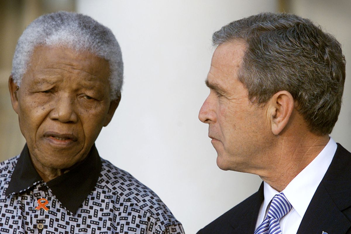 Nelson Mandela, George W. Bush          (Reuters/Kevin Lamarque)