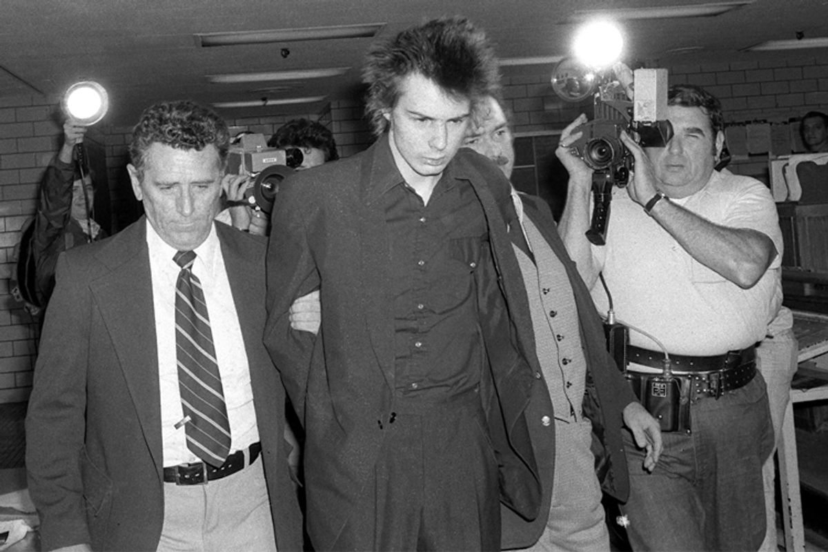 New York police escort Sid Vicious, shortly before he was charged with murder in the stabbing death of Nancy Spungen, at New York's Chelsea Hotel, Oct. 13, 1978.   (AP)