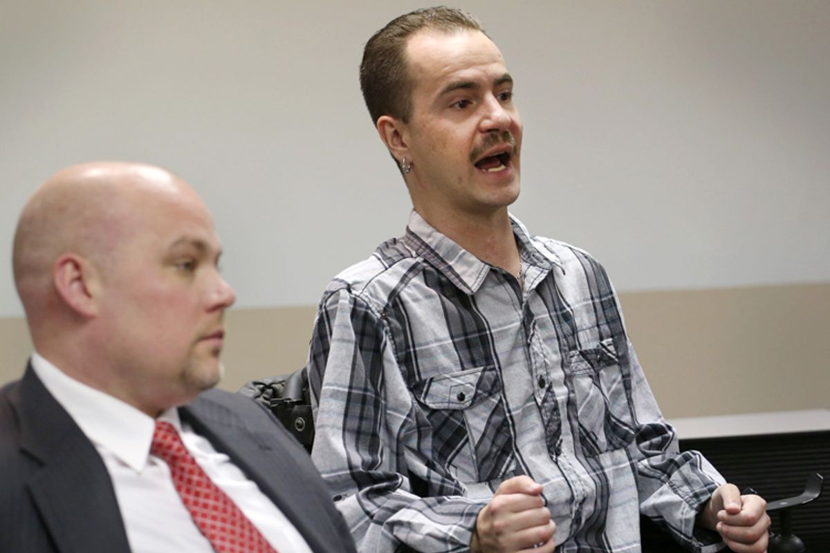 Brandon Coats, right, with his attorney, Michael Evans, left.           (AP/Ed Andrieski)