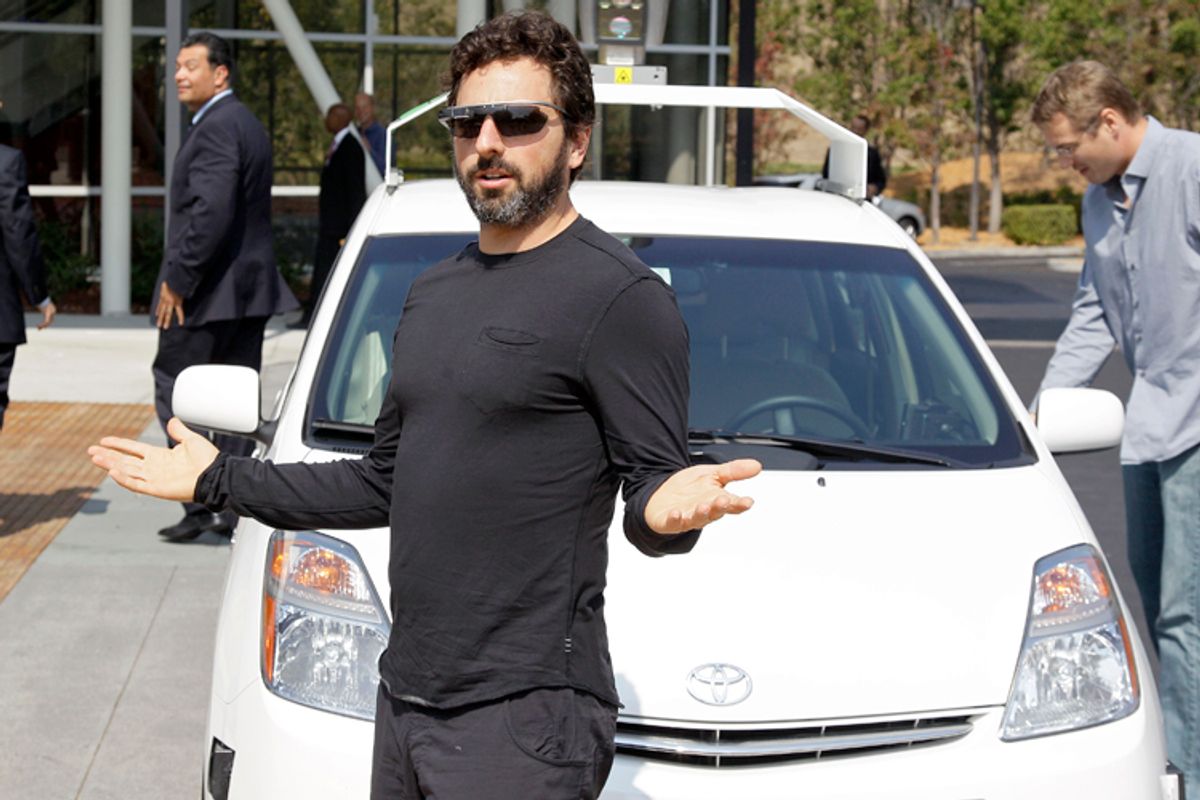 Sergey Brin gestures after riding in a driverless car with California Gov. Jerry Brown.        (AP/Eric Risberg)