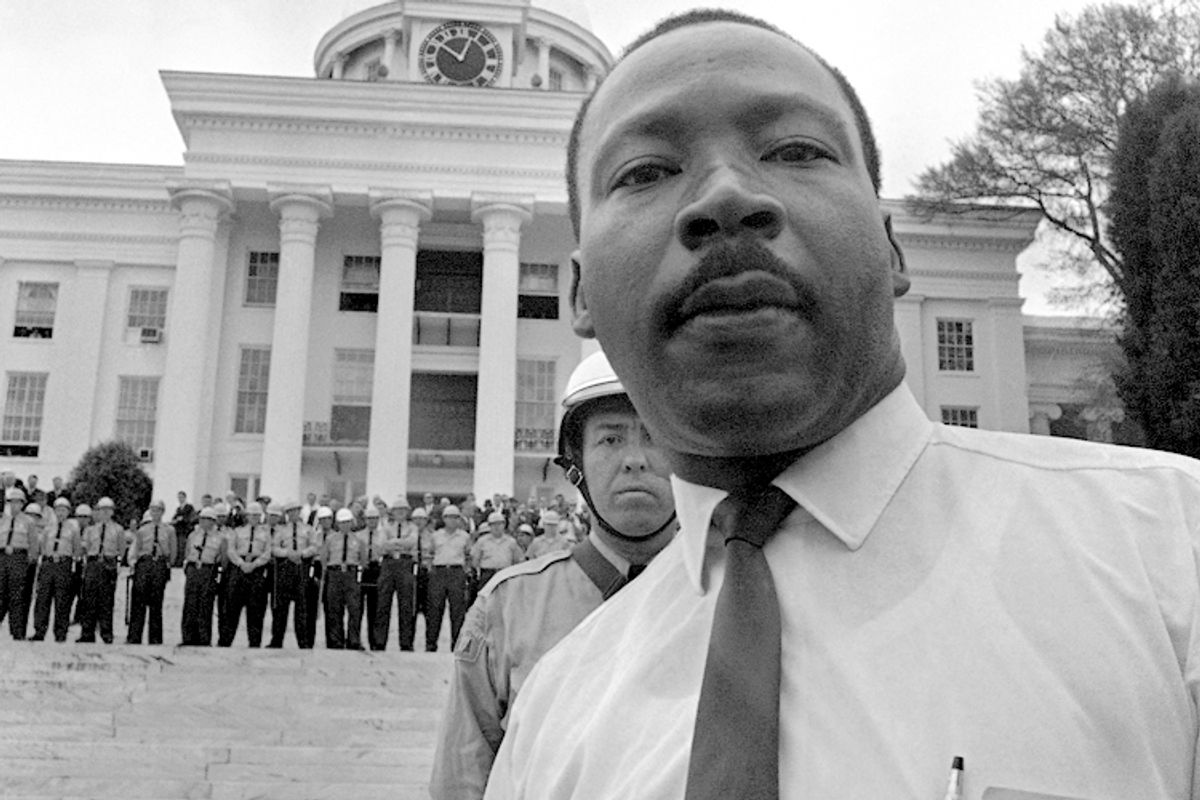 State troopers stand shoulder to shoulder on the steps of Alabama's State Capitol on March 25, 1965, barring Dr. Martin Luther King, Jr. from entering.      (AP)