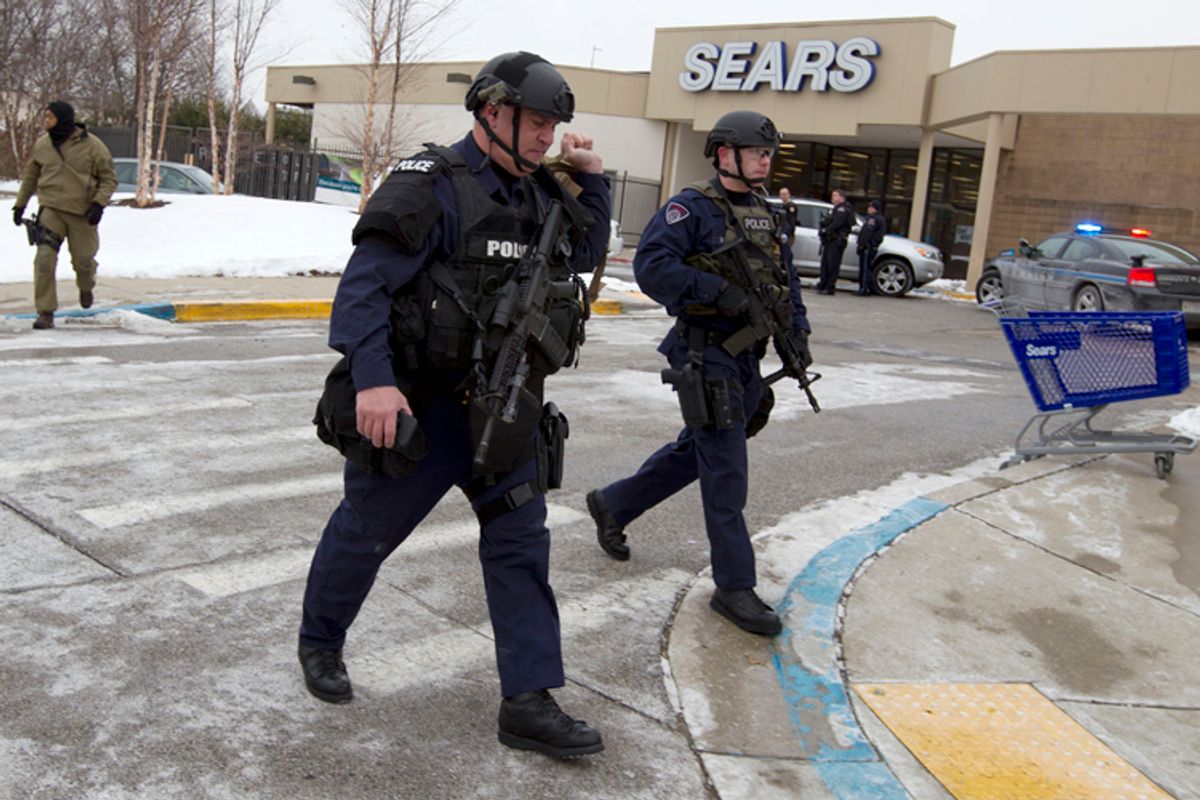 Police move in from a parking lot to the Mall in Columbia after reports of a multiple shooting, Saturday Jan. 25, 2014 Howard County, Md.      (AP/Jose Luis Magana)