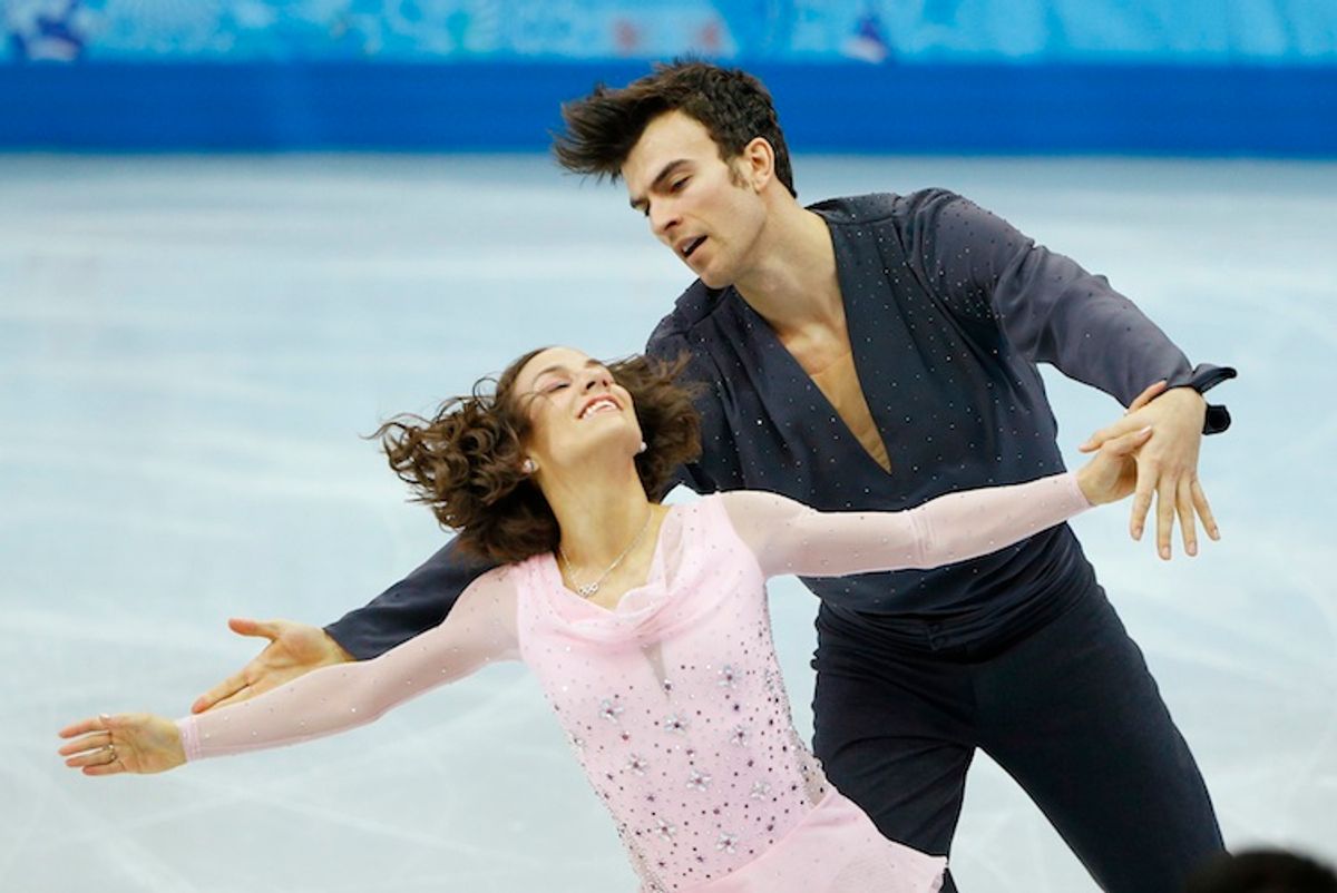 Meagan Duhamel and Eric Radford of Canada compete during the Team Pairs Short Program at the Sochi 2014 Winter Olympics, February 6, 2014.             (Reuters/Brian Snyder)