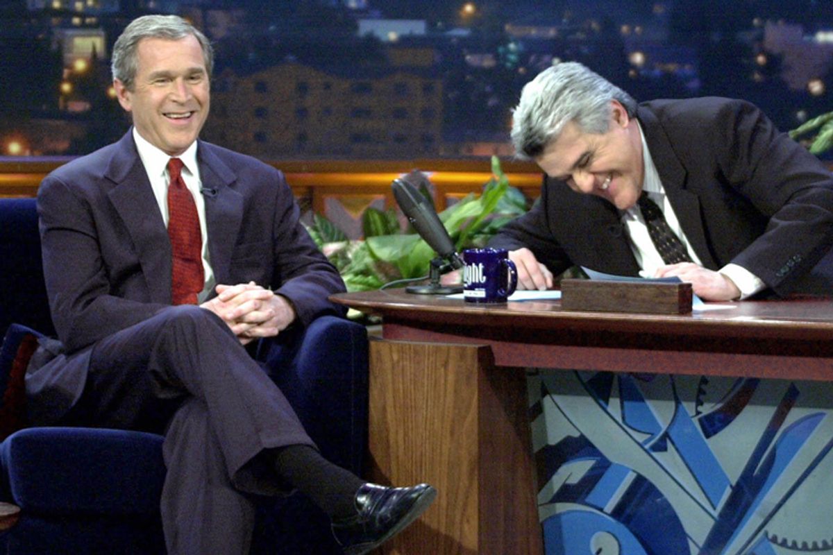 George W. Bush laughs during an appearance on "The Tonight Show with Jay Leno" on March 6, 2000.      (AP/Eric Draper)