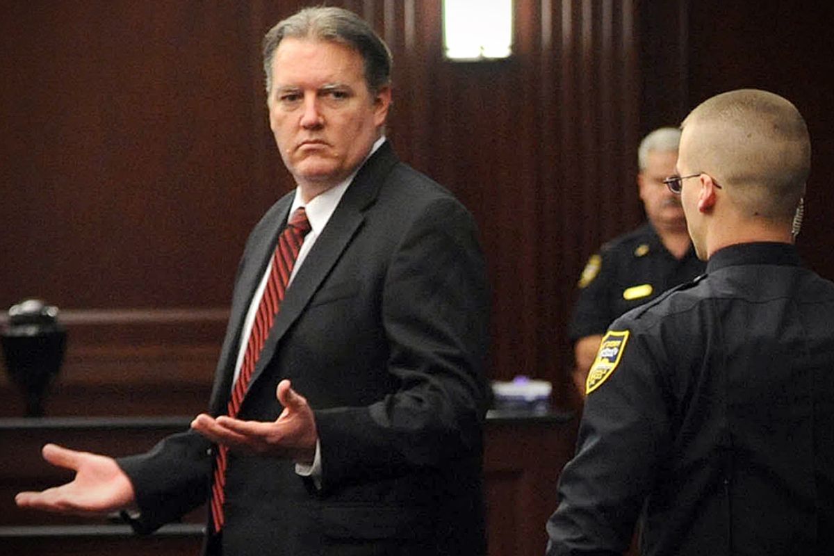 Michael Dunn reacts after the verdict is read in Jacksonville, Fla., Saturday, Feb. 15, 2014. Dunn was convicted of attempted murder in the shooting death of a teenager over an argument over loud music, but jurors could not agree on the most serious charge of first-degree murder. (The Florida Times-Union, Bob Mack, Pool)    (AP/Bob Mack)