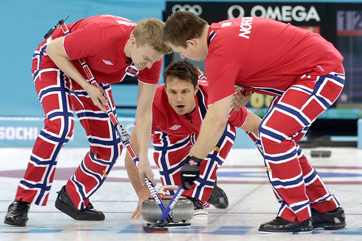 Norway's vice Torger Nergaard delivers a stone as lead, Haavard Vad Petersson, and second, Christoffer Svae, sweep during their men's curling round robin game against Sweden, February 13, 2014.     (Reuters/Ints Kalnins)