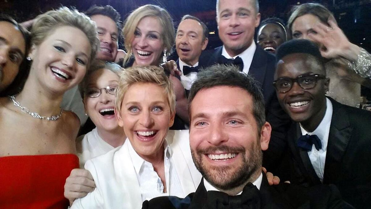 This image released by Ellen DeGeneres shows actors, front row from left, Jared Leto, Jennifer Lawrence, Meryl Streep, Ellen DeGeneres, Bradley Cooper, Peter Nyongo Jr. and, second row, from left, Channing Tatum, Julia Roberts, Kevin Spacey, Brad Pitt, Lupita Nyongo and Angelina Jolie as they pose for a "selfie" portrait on a cell phone during the Oscars at the Dolby Theatre on Sunday, March 2, 2014, in Los Angeles. (AP Photo/Ellen DeGeneres) (AP)