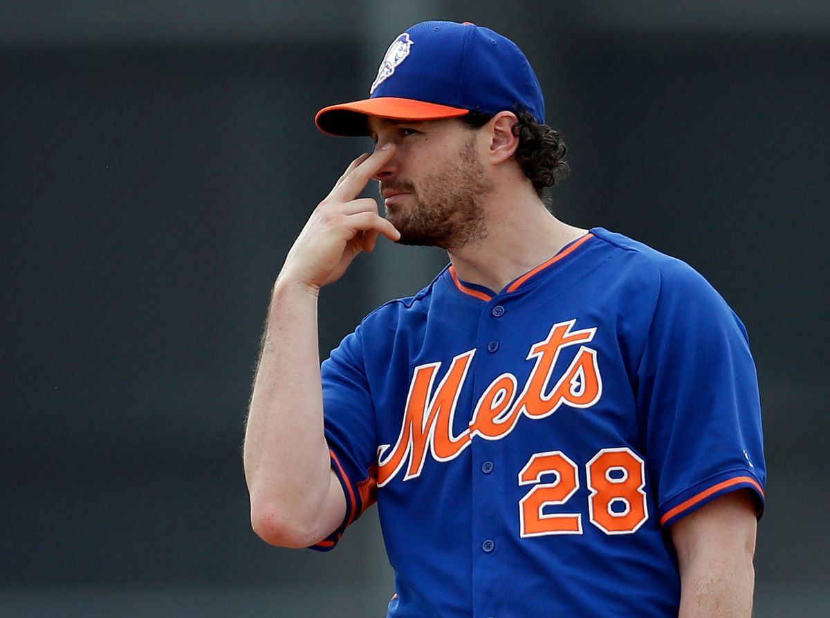 New York Mets infielder Daniel Murphy signals to a teammate during spring training baseball practice Saturday, Feb. 22, 2014, in Port St. Lucie, Fla.   (AP)
