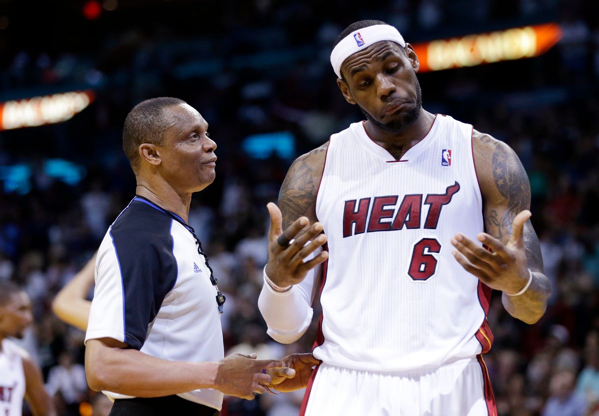 Miami Heat's LeBron James, right, reacts as he talks with official Michael Smith during the second half of an NBA basketball game against the Indiana Pacers, Friday, April 11, 2014, in Miami. The Heat defeated the Pacers 98-86. (AP Photo/Lynne Sladky) (AP)