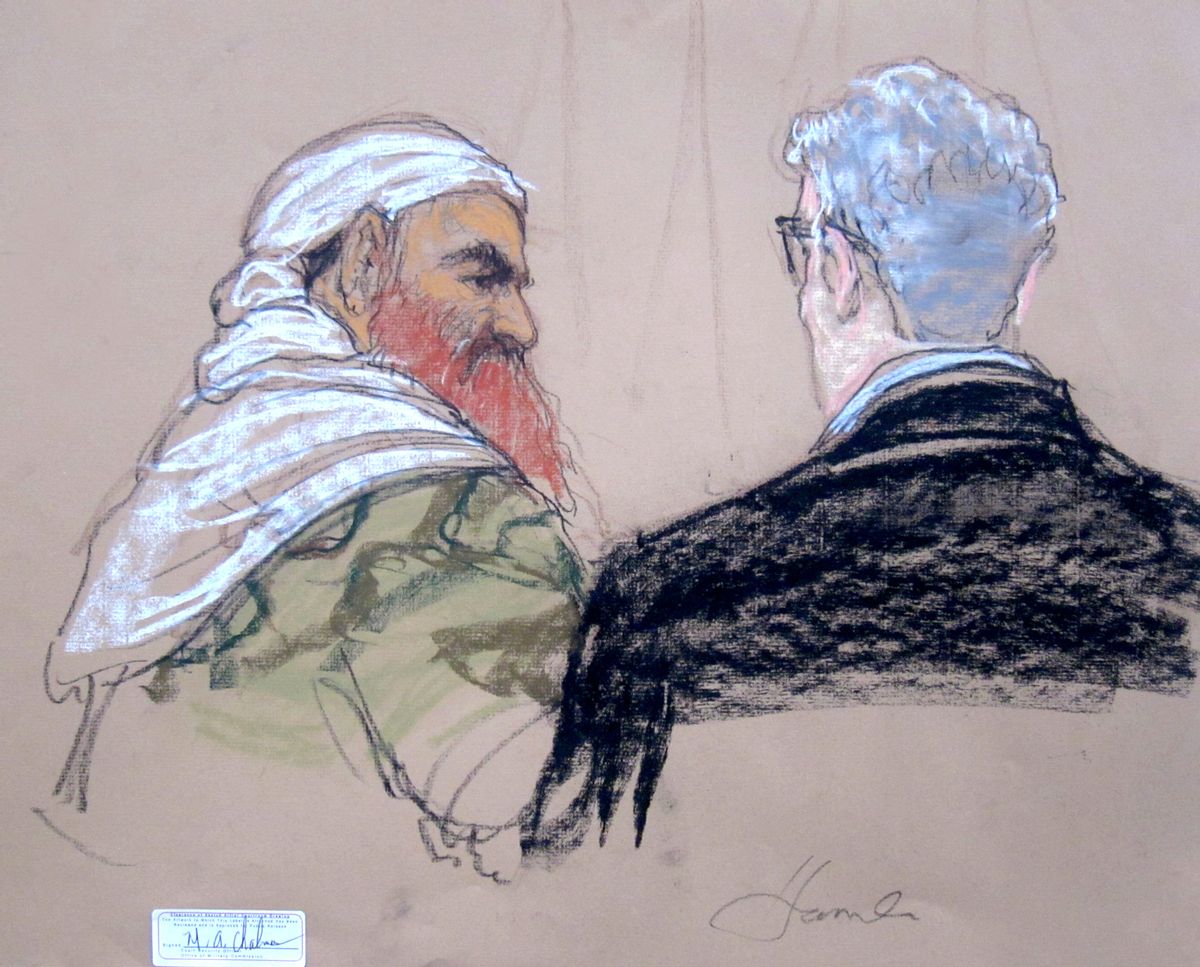 In this pool photo of a Pentagon-approved sketch by court artist Janet Hamlin, defendant Khalid Sheikh Mohammed, left, speaks with lead defense lawyer David Nevin during a pretrial hearing at the Guantanamo Bay U.S. Naval Base in Cuba, Monday, April 14, 2014. A lawyer for one of five defendants in the Sept. 11 war crimes tribunal said Monday that FBI agents questioned a member of his defense team, apparently in an investigation related to the handling of evidence, a revelation that brought an abrupt halt to proceedings. (AP Photo/Janet Hamlin, Pool) (AP)