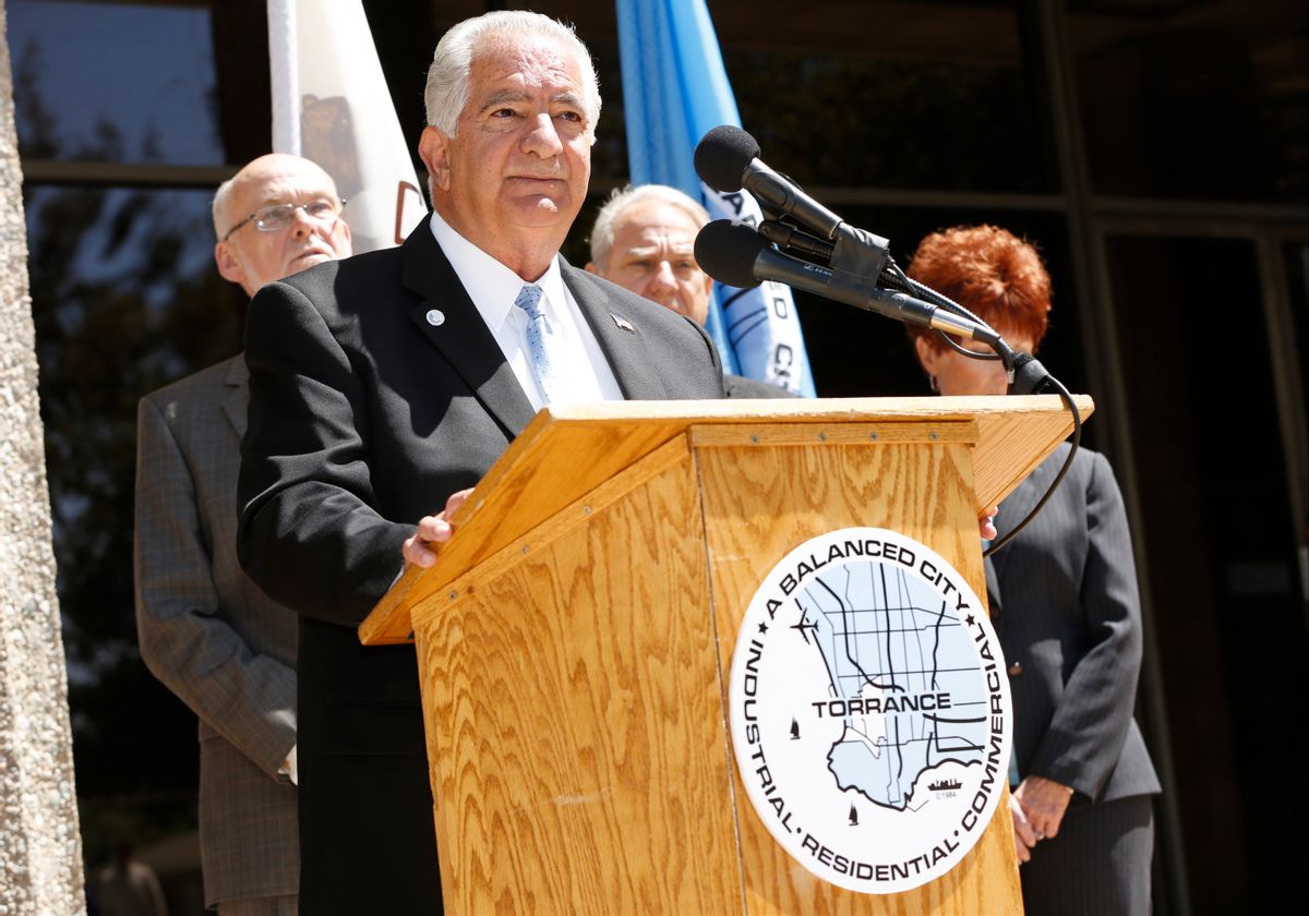 Torrance Mayor Frank Scotto, at podium, holds a news conference to discuss the announced relocation of Toyota Motor Sales' U.S. headquarters, Monday, April 28, 2014, in front of City Hall in Torrance, Calif.  Toyota said that it will move its U.S. headquarters from Torrance to Plano, Texas, a suburb of Dallas. Small groups of employees will start moving to temporary office space there this year, but most will not move until late 2016 or early 2017 when a new headquarters is completed.  (AP Photo/Damian Dovarganes) (AP)