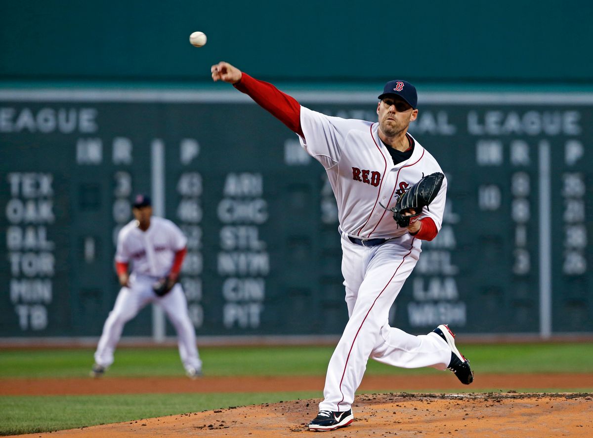 Boston Red Sox starting pitcher John Lackey delivers to the New York Yankees during the first inning of a baseball game at Fenway Park in Boston, Wednesday, April 23, 2014. (AP Photo/Elise Amendola) (AP)