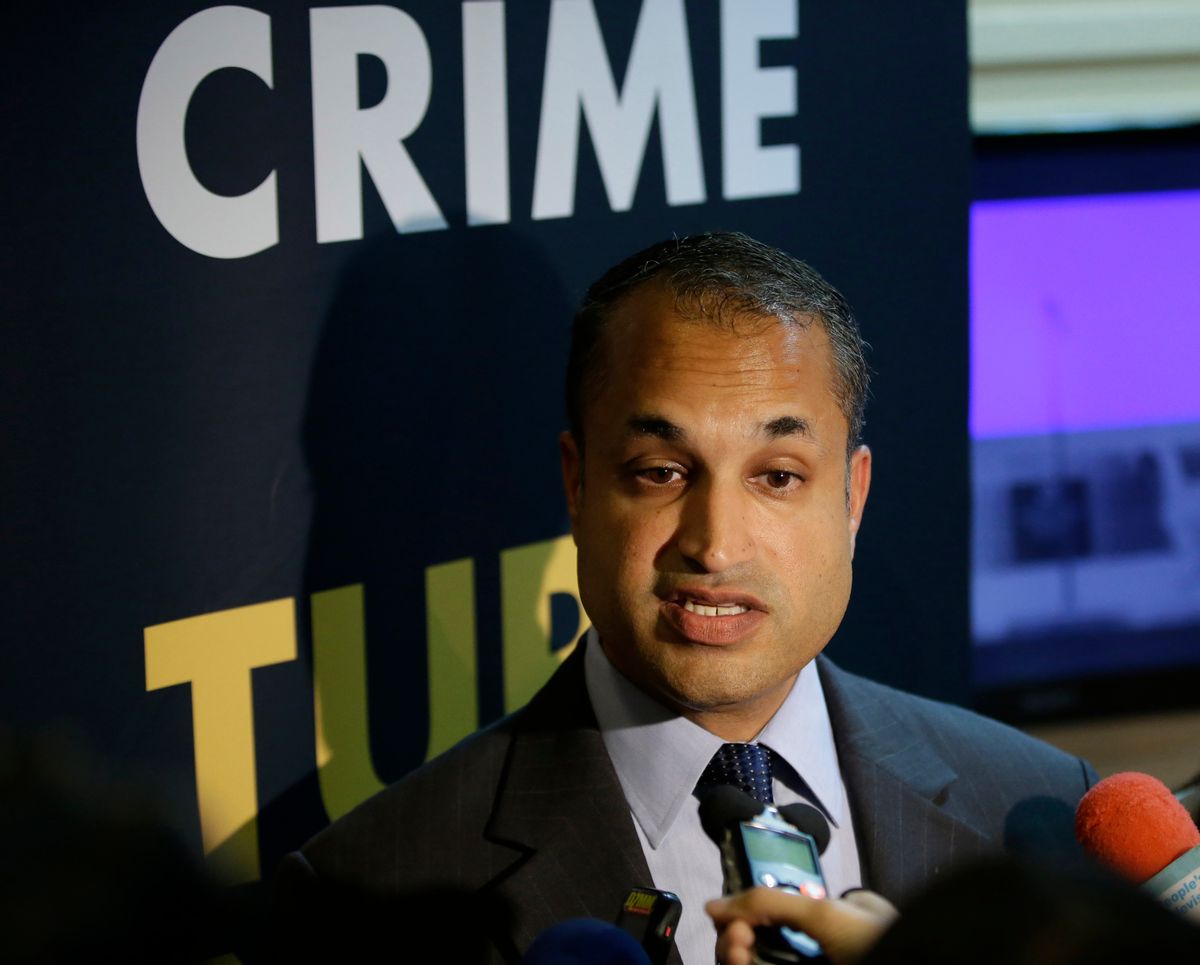 INTERPOL Digital Crime Centre Director Sanjay Virmani, is interviewed by reporters following a news conference Friday, May 2, 2014 at the Philippine National Police Headquarters at suburban Quezon city northeast of Manila, Philippines. Philippine police, backed by Interpol, have arrested dozens of suspected members of an online extortion syndicate who duped hundreds of victims worldwide into exposing themselves in front of webcams or engaging in lewd chats, including a Scottish teenager who committed suicide after being blackmailed, officials said.  (AP Photo/Bullit Marquez) (Bullit Marquez)