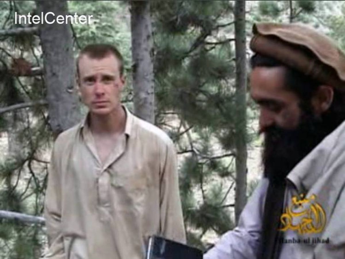This image made from video released by the Taliban and obtained by IntelCenter on Dec. 8, 2010, shows a man believed to be Bowe Bergdahl at left  (AP Photo/IntelCenter)