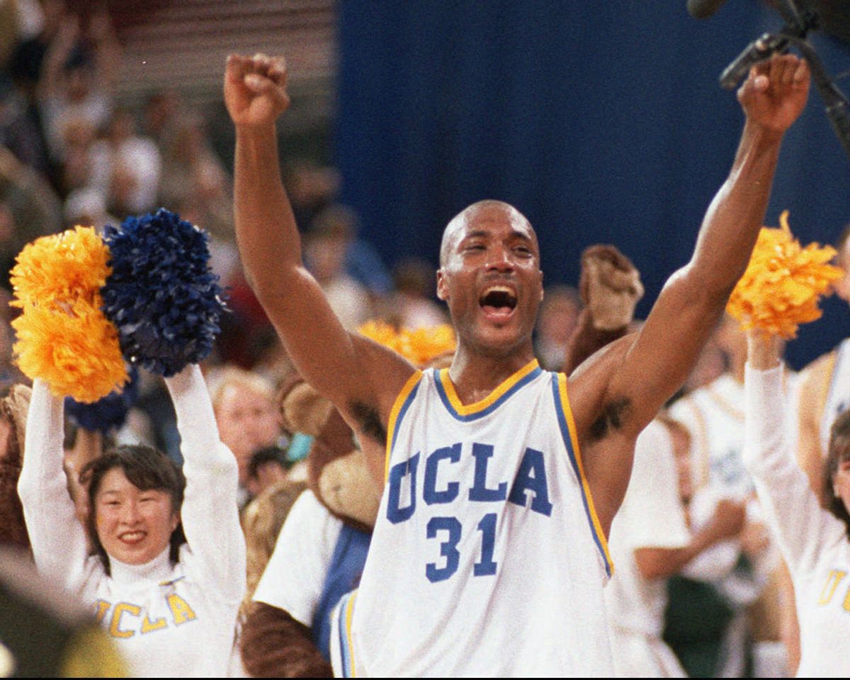 FILE - In this April 3, 1995, file photo, UCLA's Ed O'Bannon celebrates after his team won the NCAA championship game against Arkansas in Seattle. Five years after the former UCLA star filed his antitrust lawsuit against the NCAA, it goes to trial Monday, June 9, 2014, in a California courtroom.  (AP Photo/Eric Draper, File) (AP)