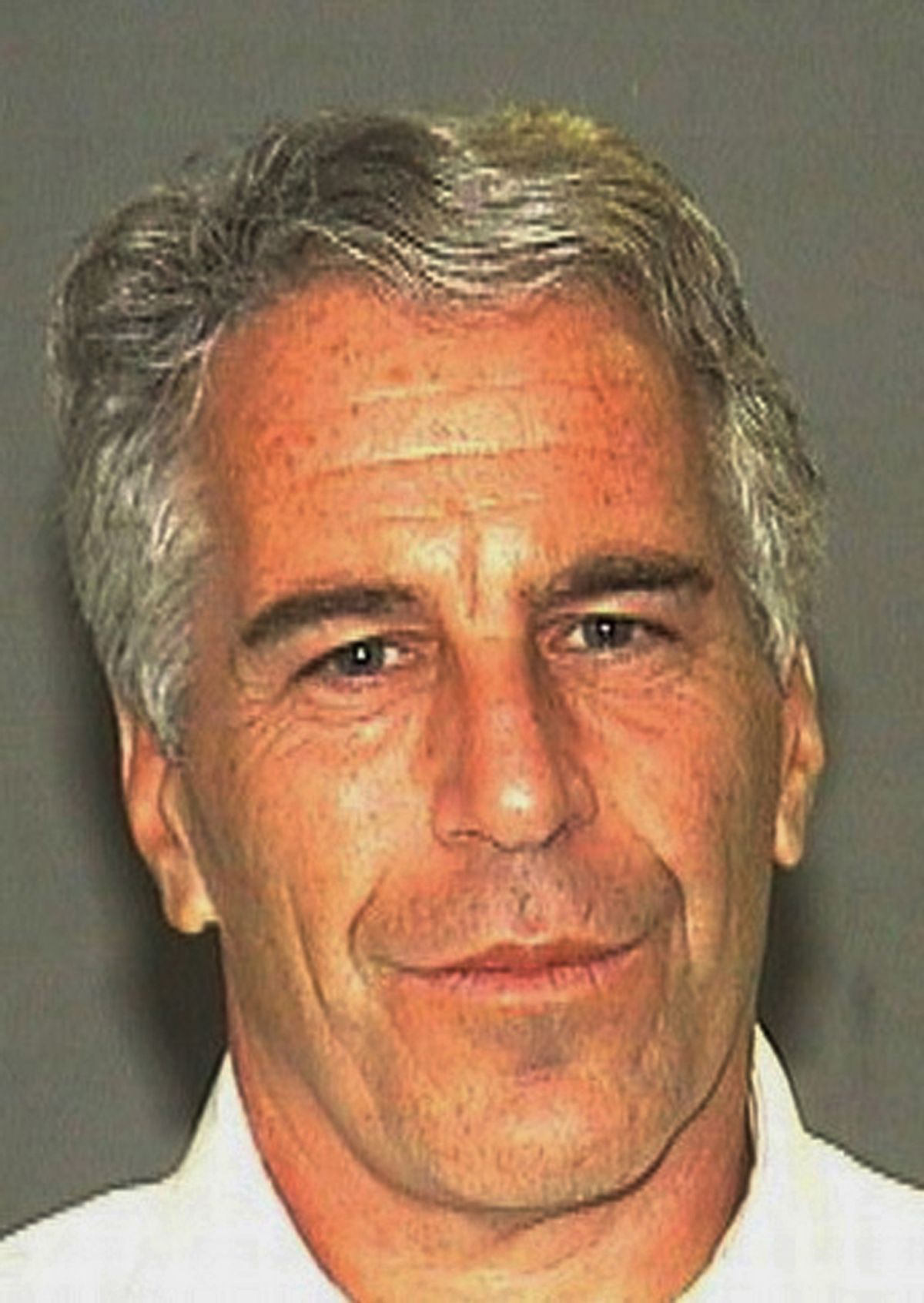 This July 27, 2006 arrest photo made available by the Palm Beach Sheriff's Office, in Florida, shows Jeffrey Epstein. Epstein was suspected nearly a decade ago of paying for sex with underage girls. The FBI abruptly dropped its investigation a few years ago, and Epstein pleaded guilty to a single state charge of soliciting prostitution. He served 13 months in jail. Now, two women who say they were sexually abused as girls by Epstein are hoping a trove of new documents will get the case reopened. (AP Photo/Palm Beach Sheriff's Office) (AP)