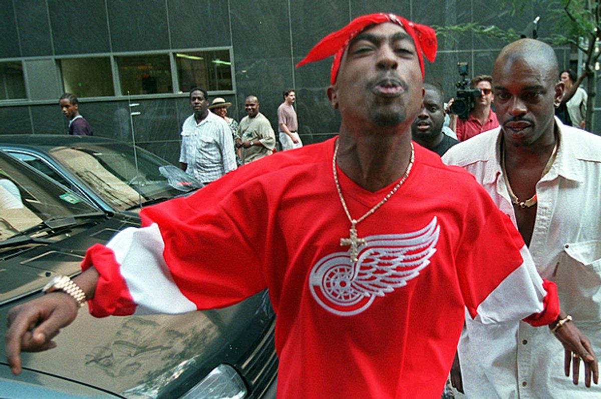 Tupac Shakur spits in the direction of reporters as he leaves state Supreme Court in New York, July 5, 1994.      (AP/Bebeto Matthews)