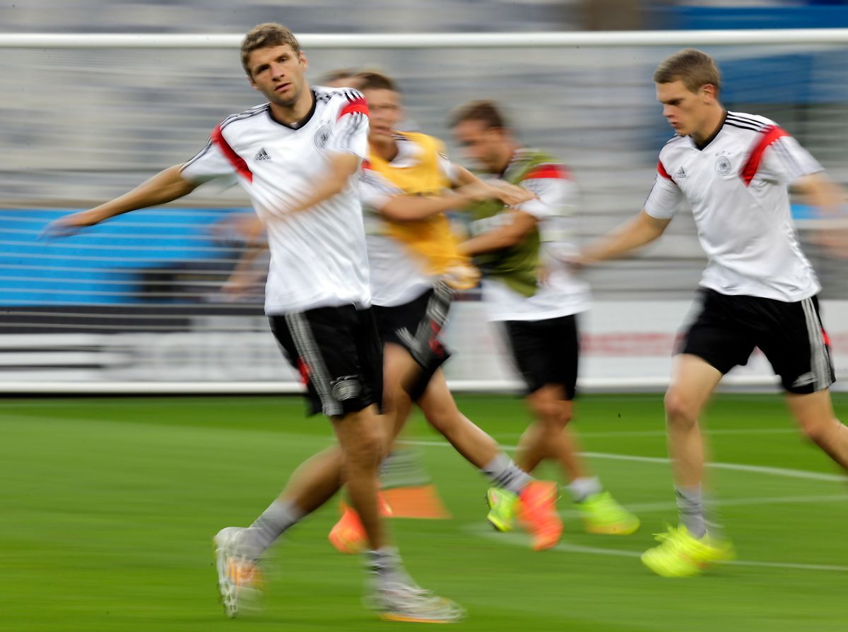 Germany's Thomas Mueller, front, arms up with teammates during a training session one day ahead of the World Cup semifinal soccer match between Brazil and Germany at the Mineirao Stadium in Belo Horizonte, Brazil, Monday, July 7, 2014. (AP Photo/Frank Augstein) (Frank Augstein)