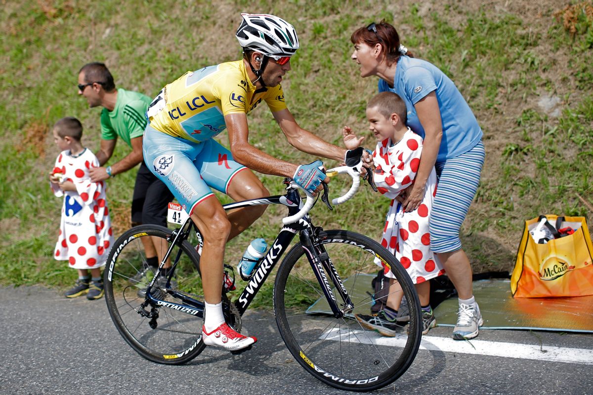 Italy's Vincenzo Nibali, wearing the overall leader's yellow jersey, climbs towards Hautacam to win the eighteenth stage of the Tour de France cycling race over 145.5 kilometers (90.4 miles) with start in Pau and finish in Hautacam, Pyrenees region, France, Thursday, July 24, 2014. (AP Photo/Laurent Cipriani) (Laurent Cipriani)