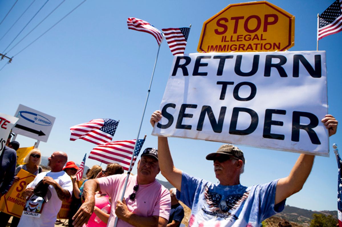 Demonstrators picket against the possible arrivals of undocumented migrants who may be processed at the Murrieta Border Patrol Station in Murrieta, California July 1, 2014.         (Reuters/Sam Hodgson)