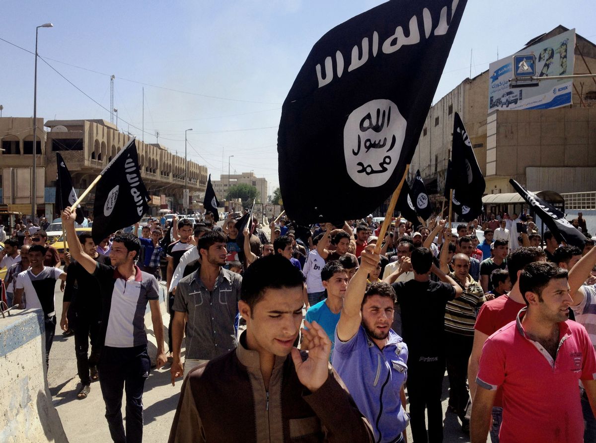 In this June 16, 2014 photo, demonstrators chant pro-Islamic State group slogans as they carry the group's flags in front of the provincial government headquarters in Mosul, 225 miles (360 kilometers) northwest of Baghdad. Flush with cash the the Islamic State fix roads, police traffic, administer courts, and have even set up an export system of smuggled crude from oil fields they control. (AP Photo, File)   (AP)
