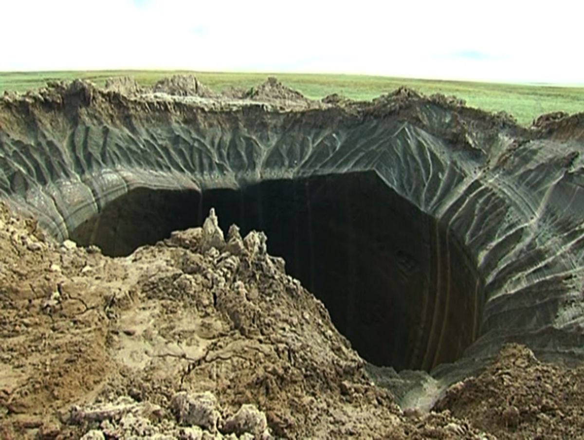 This frame grab made Wednesday, July 16, 2014, shows a crater, discovered recently in the Yamal Peninsula, in Yamalo-Nenets Autonomous Okrug, Russia. (AP Photo/Associated Press Television)     (AP)