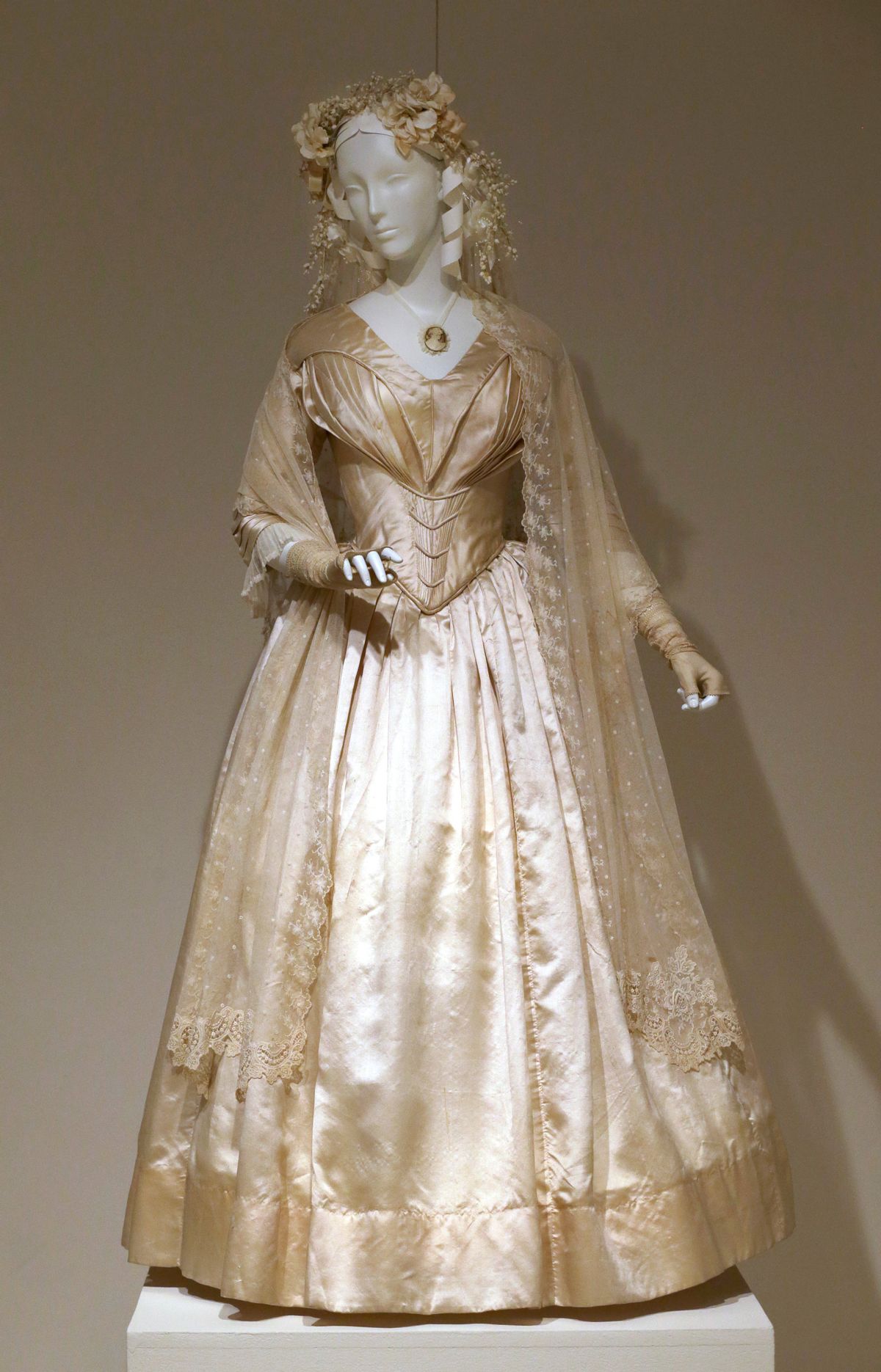 In this photo taken on Tuesday, July 1, 2014,  a wedding dress made in 1844 is displayed at the "American Brides: Inspiration and Ingenuity," exhibition in Denton, Texas.  (AP)