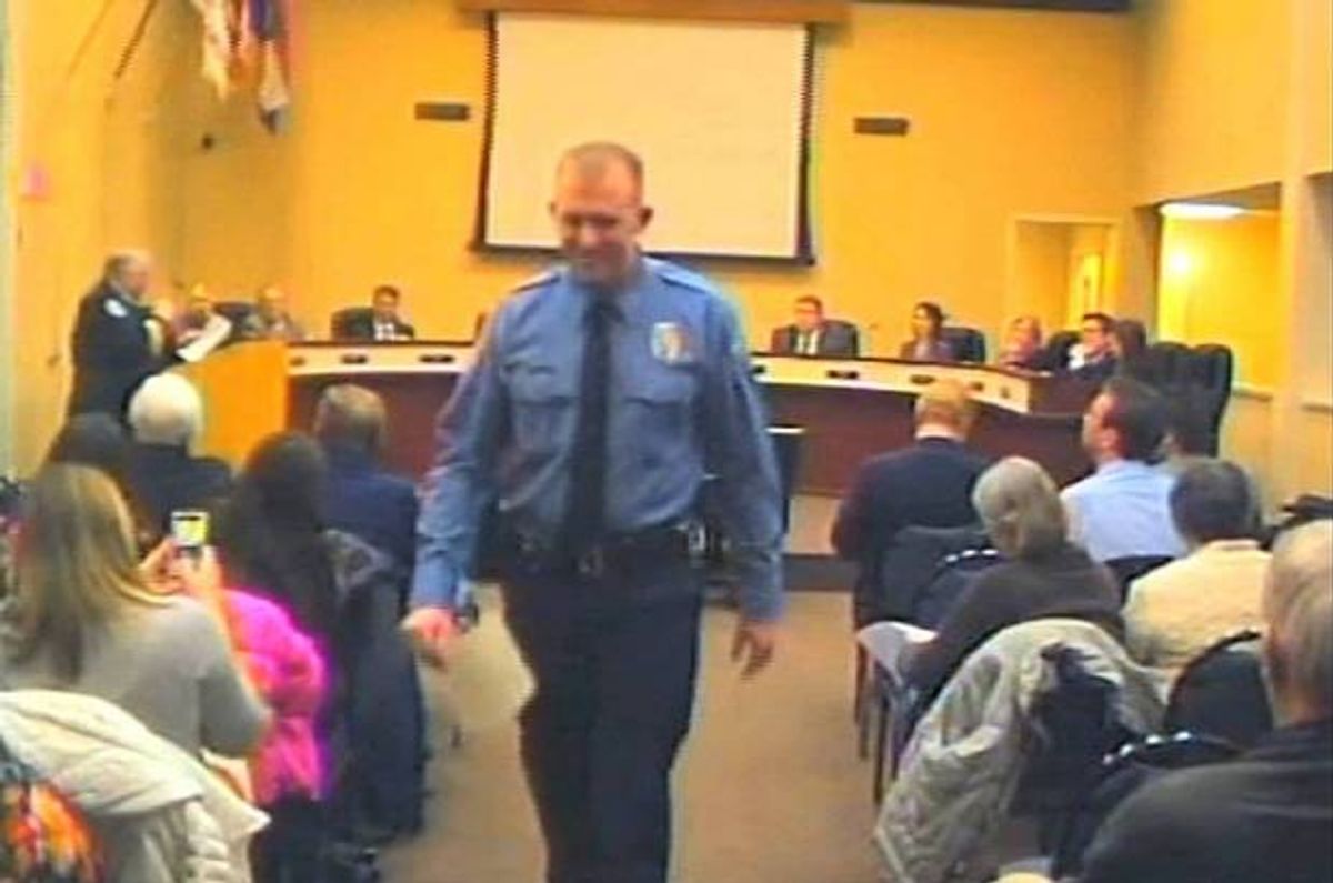 In this Feb. 11, 2014 image from video released by the City of Ferguson, Mo., officer Darren Wilson attends a city council meeting in Ferguson.         (AP/City of Ferguson)