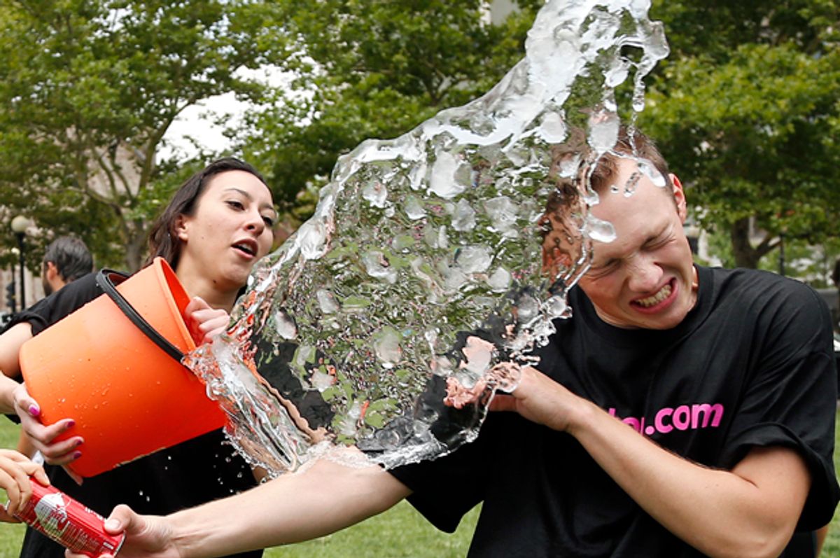 Beryl Lipton douses Matt Lee during the ice bucket challenge in Boston, Aug. 7, 2014 to raise funds and awareness for ALS.        (AP/Elise Amendola)