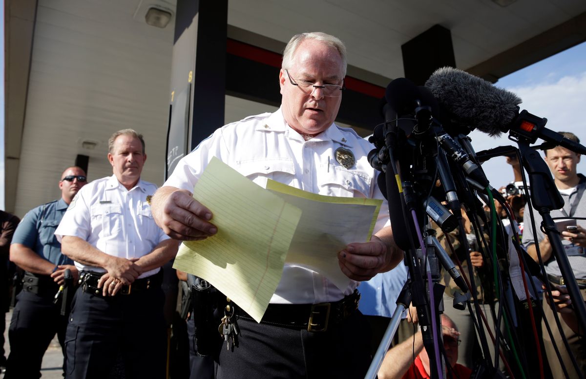 Ferguson Police Chief Thomas Jackson releases the name of the the officer accused of fatally shooting Michael Brown,  an unarmed black teenager,  Friday, Aug. 15, 2014, in Ferguson, Mo. Jackson announced that the officer's name is Darren Wilson.   (AP/Jeff Roberson)