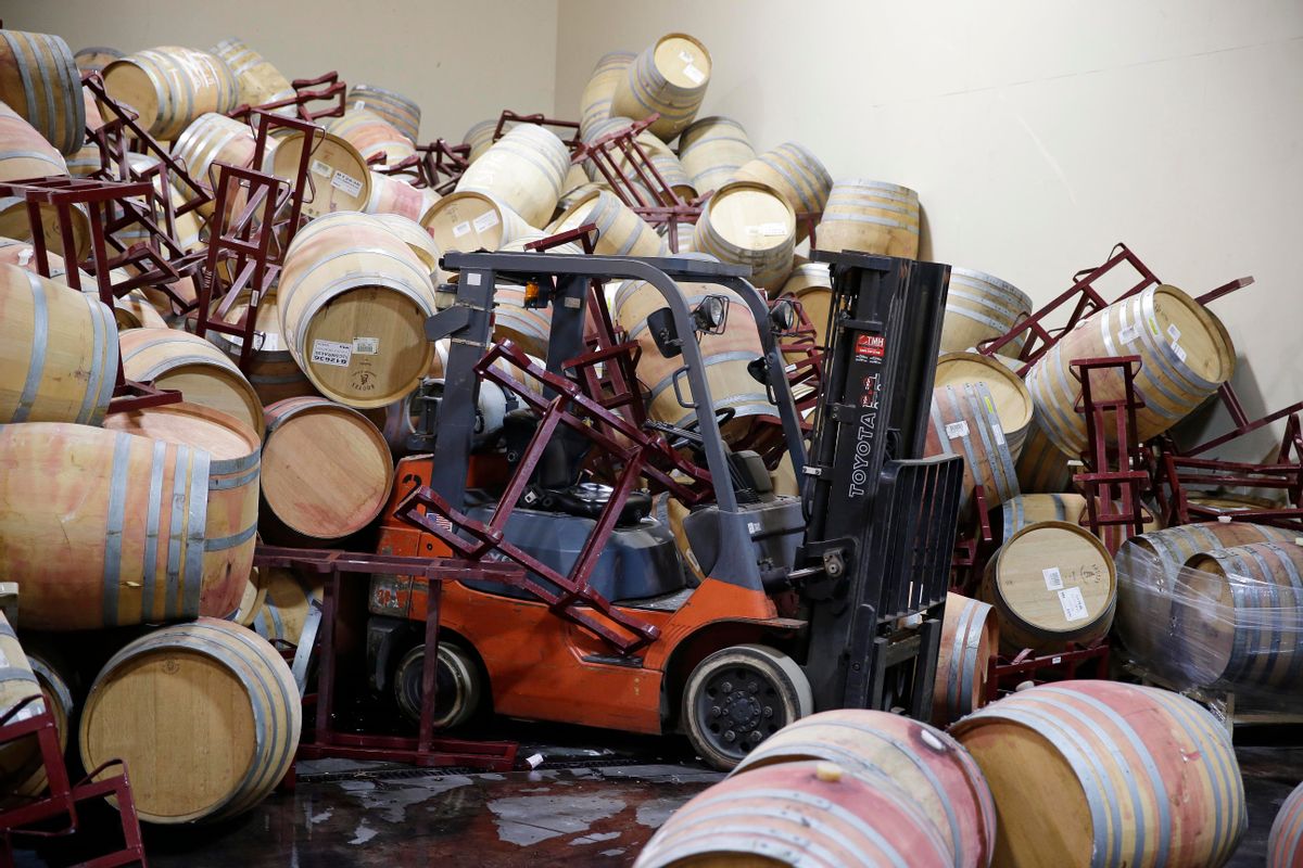 A forklift is partially buried in some of the hundreds of earthquake damaged wine barrels at the Kieu Hoang Winery Monday, Aug. 25, 2014, in Napa, Calif. A powerful earthquake that struck the heart of California's wine country caught many people sound asleep, sending dressers, mirrors and pictures crashing down around them and toppling wine bottles in vineyards around the region. The magnitude-6.0 quake struck at 3:20 a.m. PDT Sunday near the city of Napa. (AP Photo/Eric Risberg)  (AP)