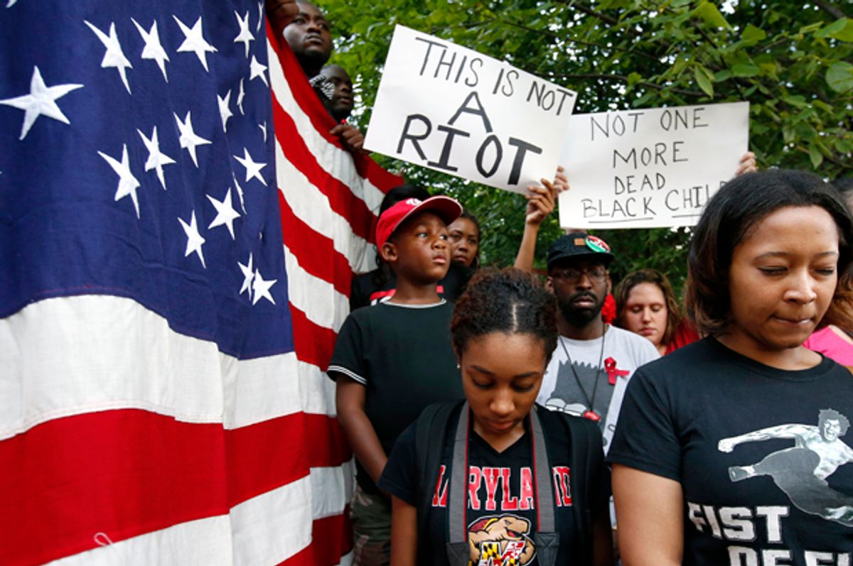 Protesters at Meridian Hill Park, also known as Malcom X Park, Aug. 14, 2014 in Washington, to protest the fatal shooting of Michael Brown by police in Ferguson, Mo.         (AP/Alex Brandon)