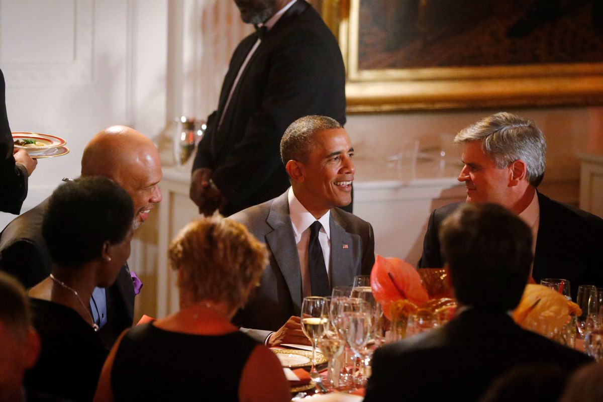 President Barack Obama is seated with Kareem Abdul-Jabbar, retired American professional basketball player, and businessman Steve Case at a dinner for the Special Olympics in the East Room at the White House in Washington, Thursday, July 31, 2014. (AP Photo/Charles Dharapak)  (AP)
