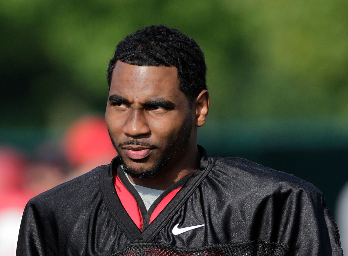 FILE - In this Aug. 9, 2014, file photo, Ohio State quarterback Braxton Miller watches teammates warm up during an NCAA college football practice in Columbus, Ohio. Miller, among the top contenders for the Heisman Trophy, reportedly reinjured his throwing shoulder during practice. The report about the two-time Big Ten offensive player of the year comes with just more than two weeks before the No. 5 Buckeyes open the season. (AP Photo/Jay LaPrete, File) (AP)