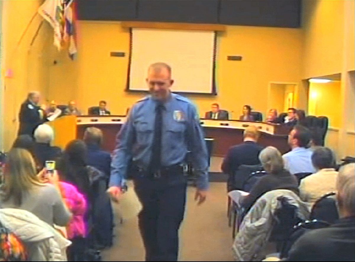 In this  Feb. 11, 2014 image from video released by the City of Ferguson, Mo., officer Darren Wilson attends a city council meeting in Ferguson.   (AP/City of Ferguson)