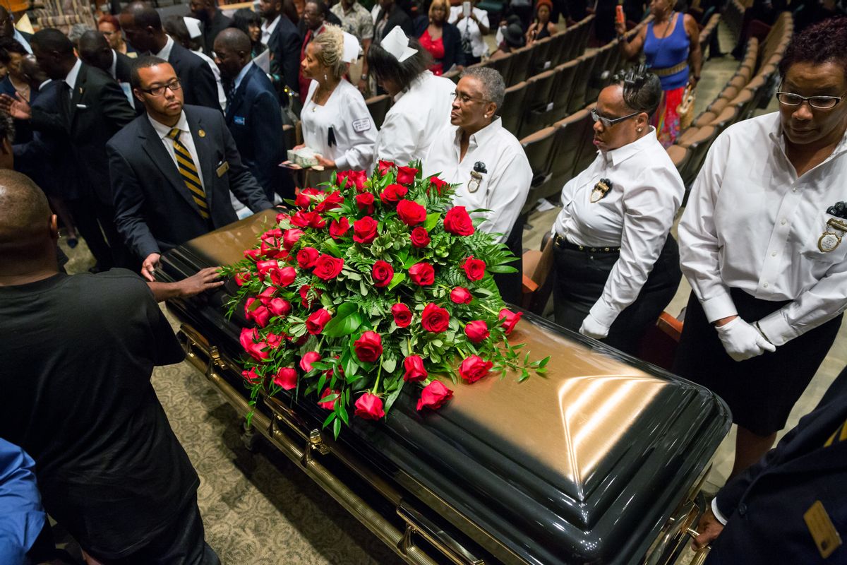 A casket containing the body of Michael Brown is wheeled out Monday, Aug. 25, 2014, at Friendly Temple Missionary Baptist Church in St. Louis. Hundreds of people gathered to say goodbye to Brown, who was shot and killed by a Ferguson, Mo., police officer on Aug. 9. (AP Photo/New York Times, Richard Perry, Pool)      (AP)