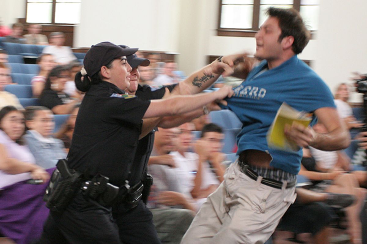 University of Florida student Andrew Meyer struggles with University Police as they try to remove him from a question and answer session with John Kerry, Sept. 17, 2007, in Gainesville, Fla. Meyer was Tasered and arrested.                      (AP/Andrew Stanfill)