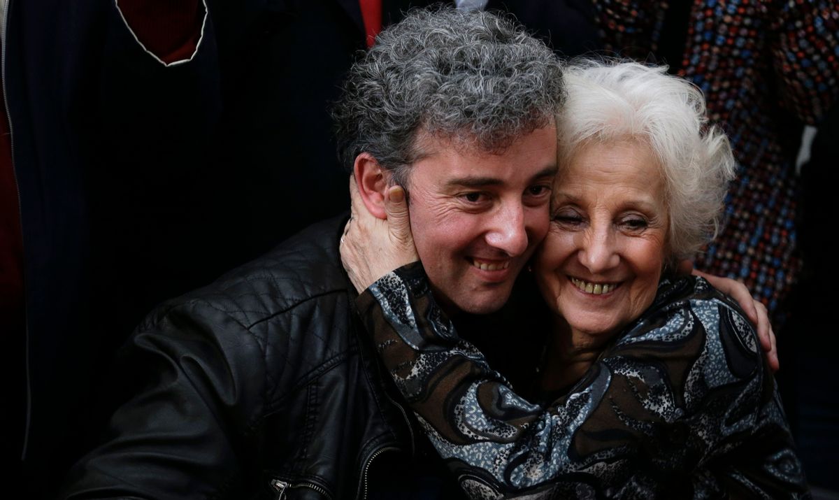 In this Friday, Aug. 8, 2014 photo, Estela de Carlotto, president of Grandmothers of Plaza de Mayo, right, and her grandson Ignacio Hurban embrace as they pose for cameras at a news conference in Buenos Aires, Argentina. Hurban, a music teacher in Argentina, made his first public appearance since he was identified as the long-sought grandson of Carlotto, the country's leading human rights activist. She spent 36 years searching for the child taken from her daughter, who was executed by the military during the country's military dictatorship. Carlotto refers to him as Guido, the name her slain daughter intended to give him. (AP Photo/Natacha Pisarenko) (AP)