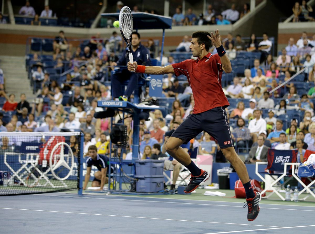 Novak Djokovic, of Serbia, returns a shot to Diego Schwartzman, of Argentina, during the opening round of the U.S. Open tennis tournament Monday, Aug. 25, 2014, in New York. (AP Photo/Darron Cummings) (AP)