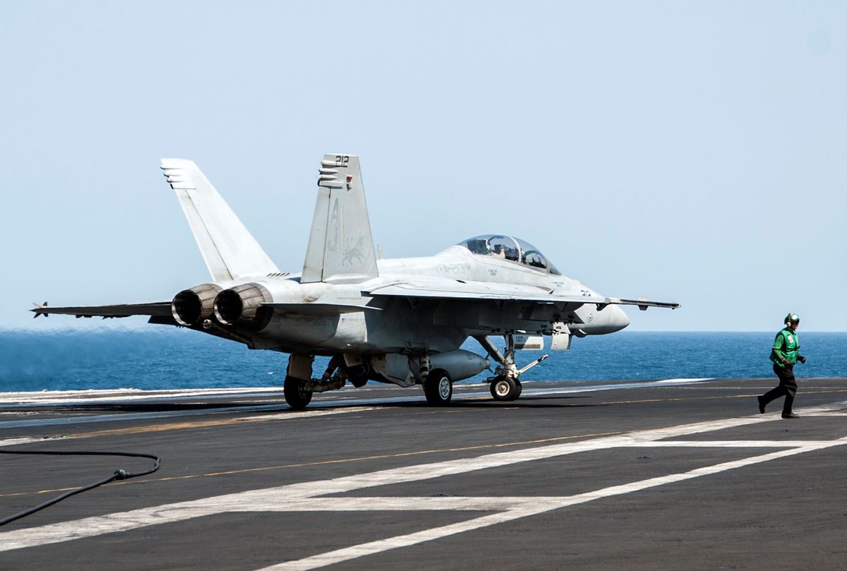 In this image provided by the U.S. Navy a F/A-18F Super Hornet attached to the Fighting Black Lions of Strike Fighter Squadron lands aboard the aircraft carrier USS George H.W. Bush in the Persian Gulf on Tuesday, Sept. 23, 2014, after conducting strike missions against Islamic State group targets in Syria. (AP Photo/U.S. Navy, Mass Communication Specialist 3rd Class Brian Stephens)  (AP)