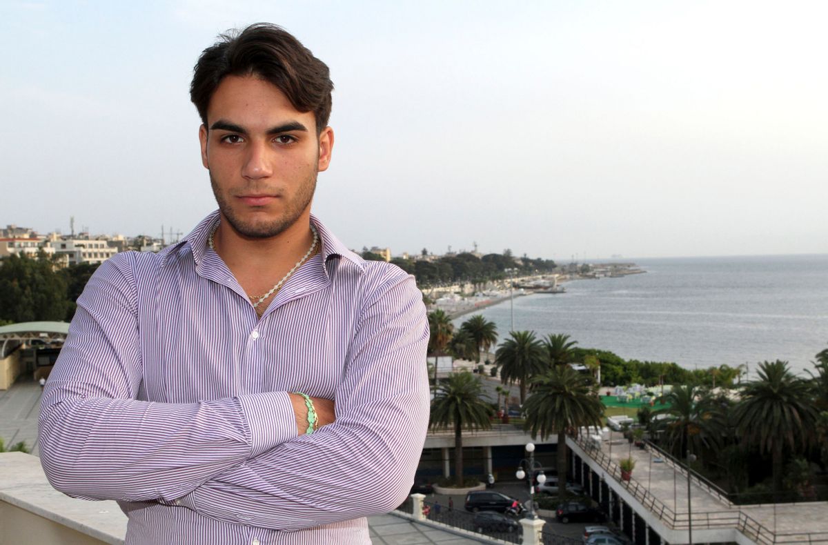 In this June 26, 2014 photo, Riccardo Cordi' stands on a terrace in Reggio, Calabria Italy with the Strait of Messina in the background. Cordi' was exiled to Messina during a pioneering anti-mafia program for juveniles, a kind of rehab away from the mob. (AP Photo/Adriana Sapone) (AP)