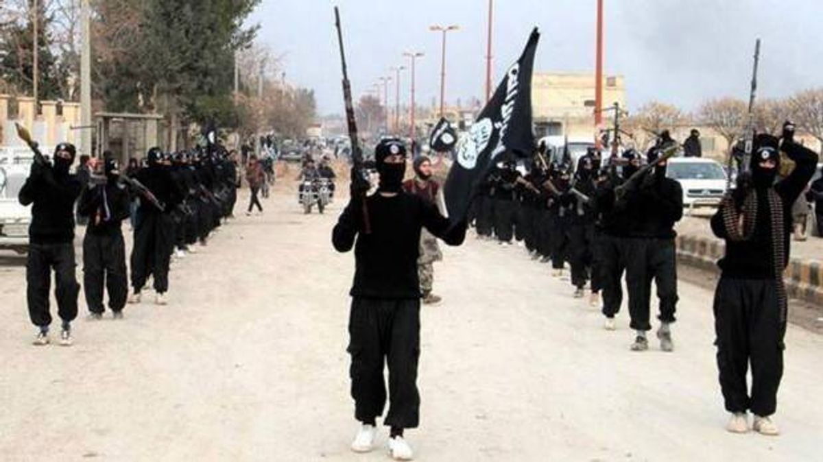 The Islamic State group march in Raqqa, Syria  (AP Photo/Militant Website)