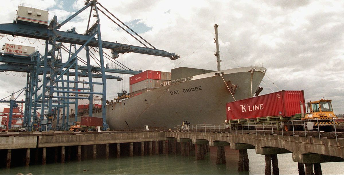 FILE - In this Friday, Sept. 5, 1997 file photo, containers are unloaded from the "K" Line ship, Bay Bridge, docked at the Port of Tacoma in Tacoma, Wash. On Friday, Sept. 26, 2014, the U.S. Justice Department said that Kawasaki Kisen Kaisha Ltd., also known as "K'' Line, pleaded guilty to one count of conspiring to fix prices for international ocean shipping services. (AP Photo/Karie Hamilton) (AP)