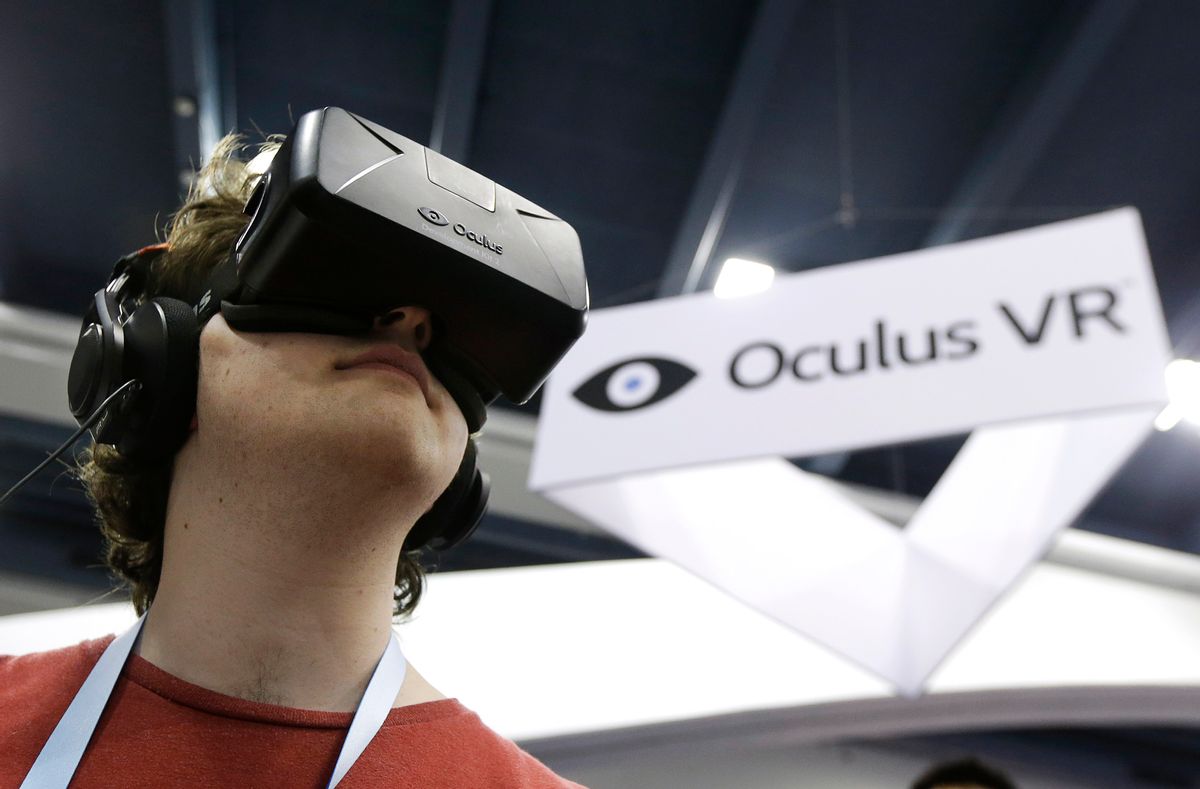 FILE - In this March 19, 2014 file photo, Peter Mason tries the Oculus virtual reality headset at the Game Developers Conference 2014 in San Francisco. Oculus, the virtual reality company acquired by Facebook earlier this year for $2 billion, is holding its first-ever developers conference and is expected to discuss the much-anticipated release of its VR headset for consumers. The two-day Oculus Connect conference begins Friday, Sept. 19, 2014.  (AP Photo/Jeff Chiu, file) (AP)
