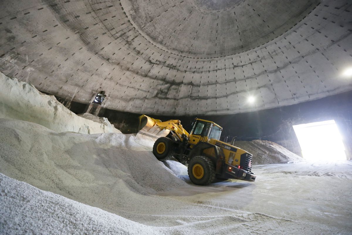In a this Sept. 16, 2014 photo salt is unloaded at the Scio Township, Mich. maintenance yard. The rewards for surviving last year's punishing winter are tight supplies of road salt and some drastic price spikes for the commodity across much of the U.S. as the next cold season approaches. Some Midwest county road officials are facing price increases that are twice or more _ even five times _ what they paid last year if they can get it. Increases of at least 20 percent have been common in cities including Boston and Raleigh, North Carolina. (AP Photo/Carlos Osorio) (AP Photo/Carlos Osorio)
