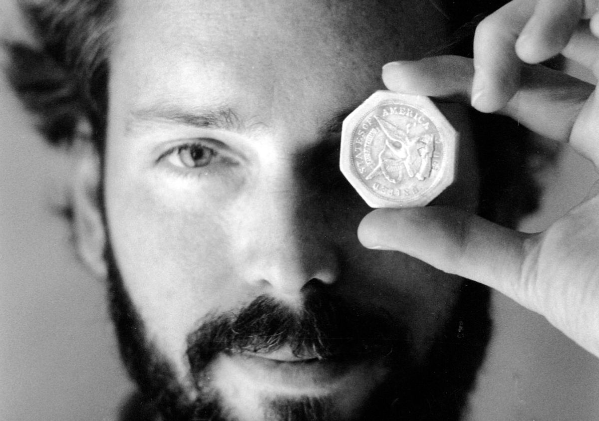 In this November 1989 photo, Tommy Thompson holds a $ 50 pioneer gold piece retrieved earlier in 1989 from the wreck of the gold ship Central America. Thompson led a group that recovered millions of dollars worth of sunken treasure only to end up involved in court cases brought by dozens of insurance companies laying claim to the treasure. (AP Photo/The Columbus Dispatch, Lon Horwedel) (AP)